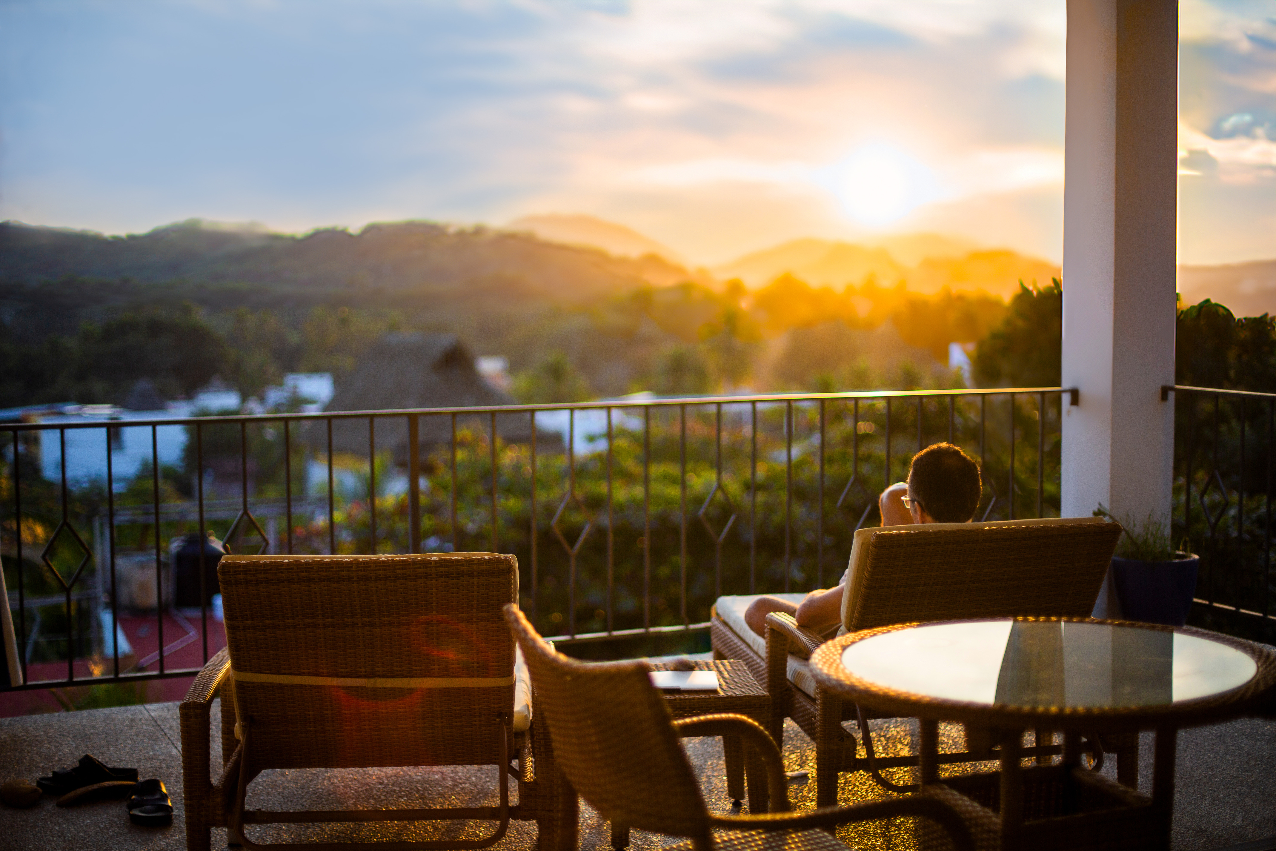 A quiet terrace above the trees at sunrise