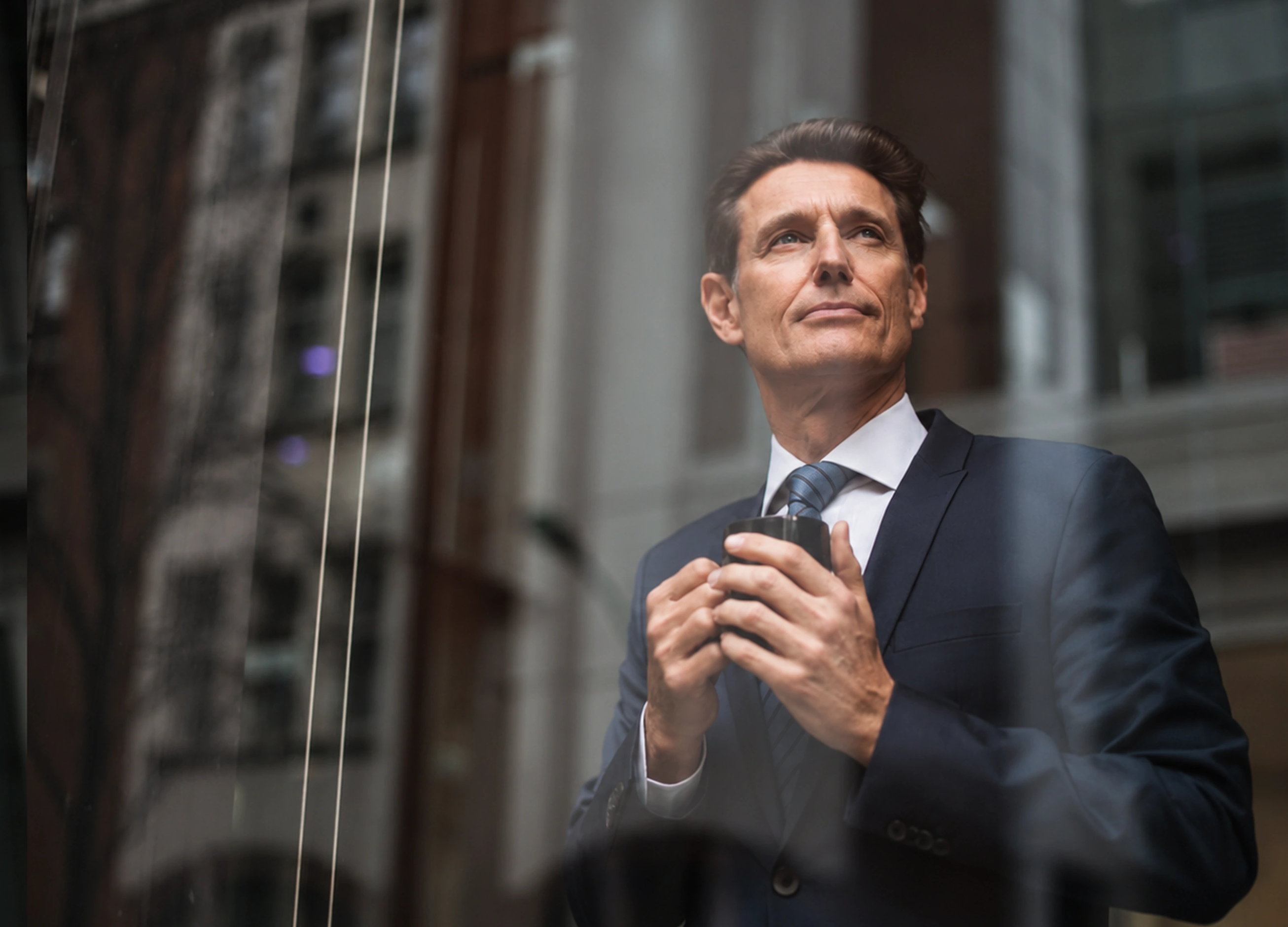 Executive looking ahead outside a modern office building